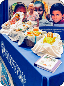 A photo of Jean Parchment and her hand-crafted dolls at ICC’s display booth at the 2022 ASI convention.

Jean Parchment’s artistry was on display at the national ASI convention. The “adoption” of her “Reborn Dolls” provide funding to bless ICC children in the D.R. Congo.