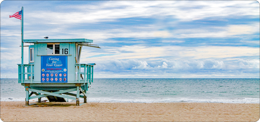 Like lifeguards at the beach you can rescue a child by becoming a sponsor. This image depicts a lifeguard station at a Southern California beach.